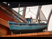 Pourquoi la peinture est-elle importante dans la réalisation d'une maquette de bateau réaliste ?