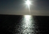 Photo soleil reflettant sur la mer